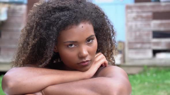 Beautiful young woman looking at camera