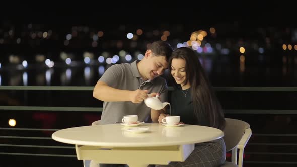 A Romantic Couple Having Fun in a Cafe in Love with Valentine's Day