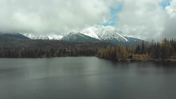 Aerial View of Strbske Pleso in the Clouds and Snowy Mountains. Slovakia