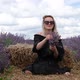 Young caucasian female woman holding violet aromatic flowers in endless lavender field. Slow motion. - VideoHive Item for Sale