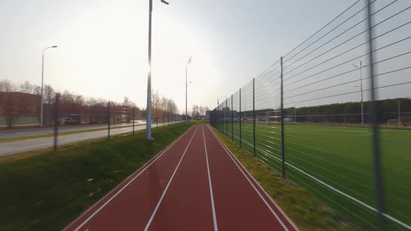 Running Track with Markings Around Large Sports Ground