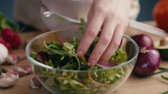 Close up woman making healthy salat at home. Shot with RED helium camera in 4K.