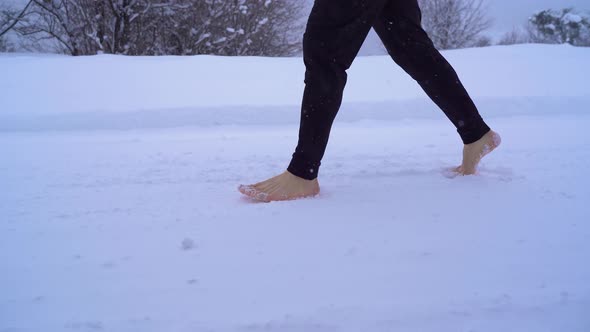 Walking barefoot in the snow.