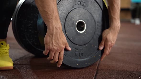 Man with training equipment in sport gym. 