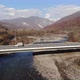 Aerial View of a Cars Riding on a Bridge Over a River, Shooting From a Drone. Cinematic Aerial - VideoHive Item for Sale