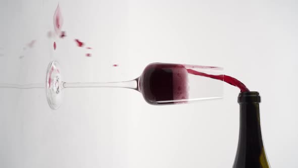 Vertical video, Close-up of sparkling champagne being poured into a glass; bubbles in a glass