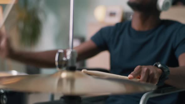 Black Male with Disability Enjoying Music and Playing Drums