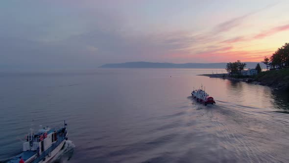 Aerial Footage of a White Excursion Boat on the Water of Lake