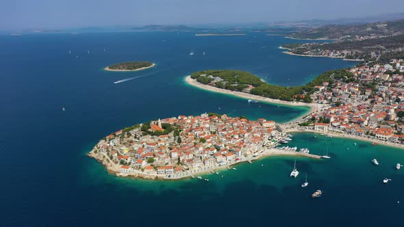 Primosten town, Croatia. View of the city from the air. Seascape with beach and old town.