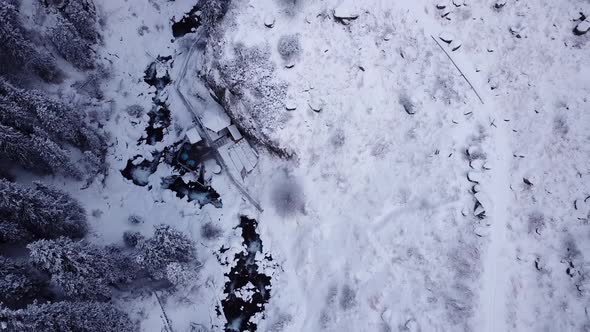 Hot Springs in the Snowy Forest and Mountains