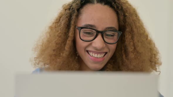 Portrait of African Woman Talking on Video Call on Laptop