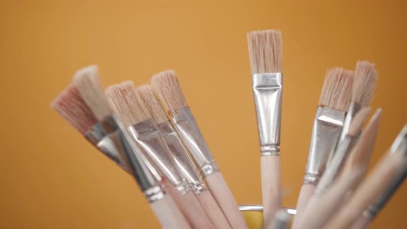 Close Up of Hand Taking Brush Painter in Workshop Studio