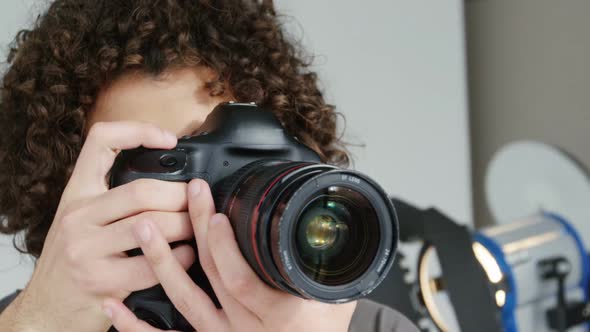 Photographer taking photo with professional digital camera