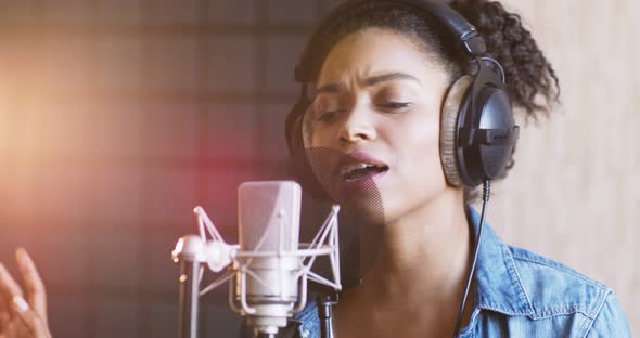 African American Lady Singing Song at Professional Sound Record Studio, Slow Motion