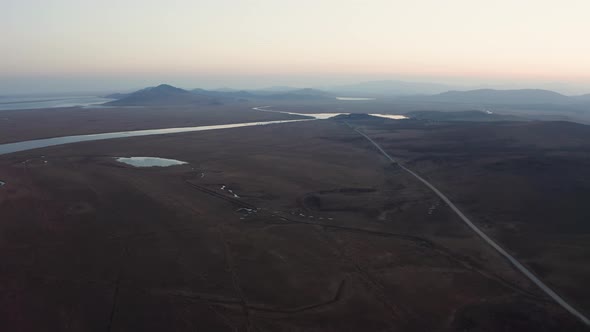 Aerial Footage of a Flock of Whitenecked Cranes at Sunset