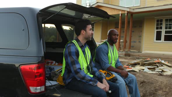 Construction workers take a break from work alt