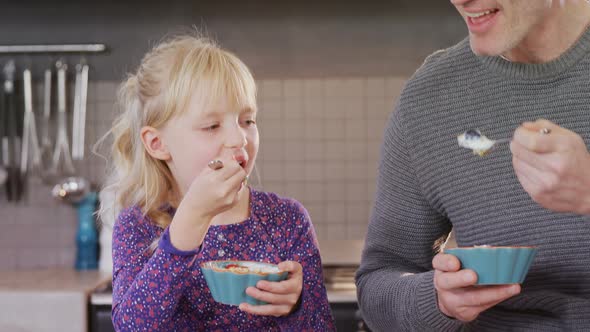 Daughter and father having breakfast 4k