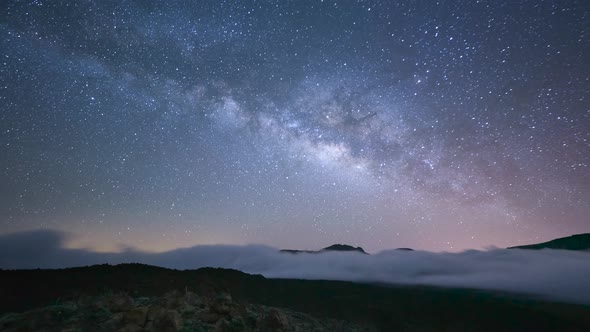 Milky way and stars over clouds in Spain