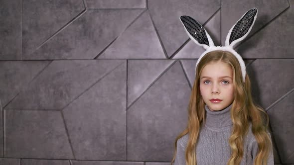 Portrait of a Cute Little Girl Dressed in Ears Easter Bunny