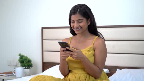 Indian woman talking to somebody through messages