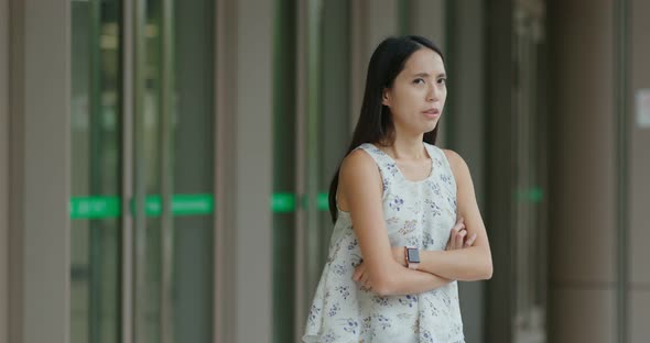 Woman waiting for friends and feeling angry 