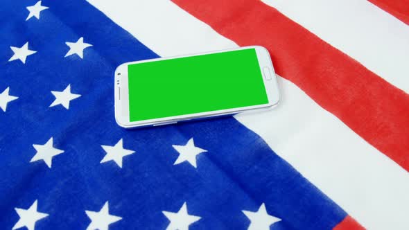 Mobile phone on American flag
