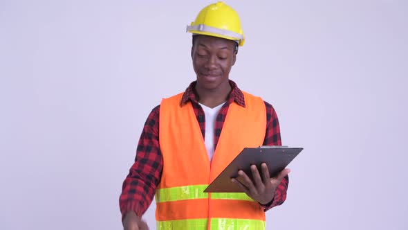 Young Happy African Man Construction Worker Interviewing with Clipboard