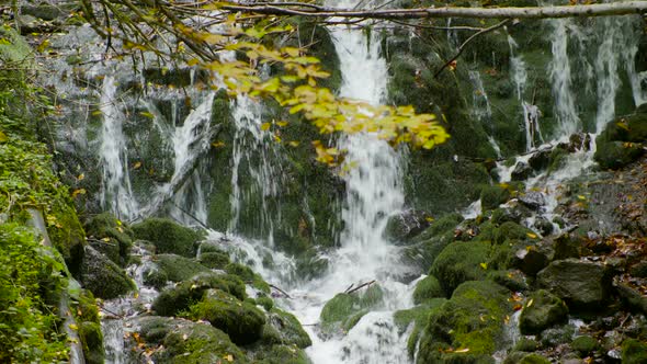 Waterfall in the forest in autumn.