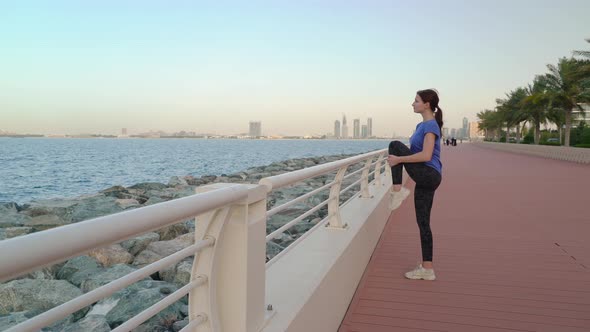 Girl Does Stretching Near the Sea