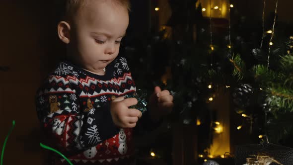 Toddler Boy Unpacking Christmas Present