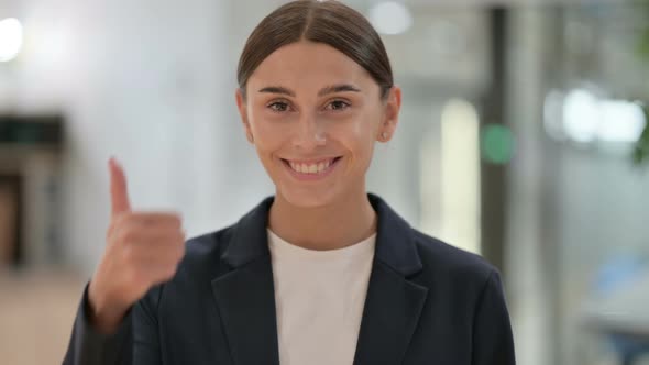 Portrait of Positive Businesswoman Doing Thumbs Up Sign