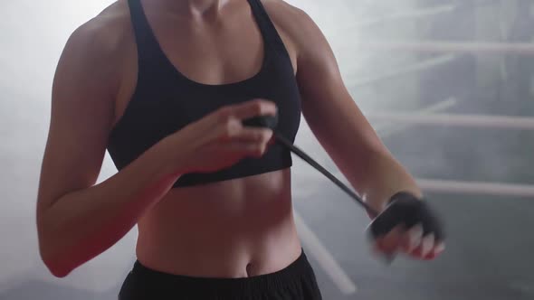 Female Fighter Wraps Her Hands with Boxing Bandages Kickboxing Training Day in a Gym the Girl is