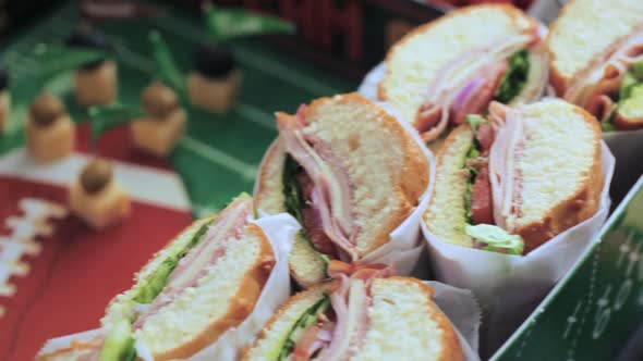 Football Snack Stadium filled with sub sandwiches, veggies and chips.