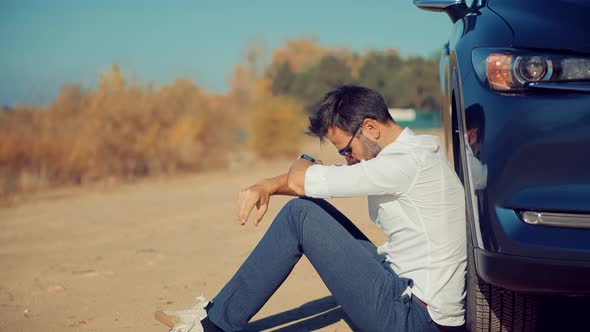 Desperate Businessman Sitting Near Broken Car. Office Burnout Syndrome. After Fired Job.