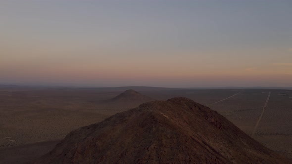 Aerial drone footage of Mojave Desert mountains at sunrise in California