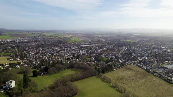 Aerial zoom out from view of Rural Perthshire Farming Town Blairgowrie and Rattray