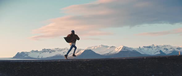 Person runs across beautiful landscape