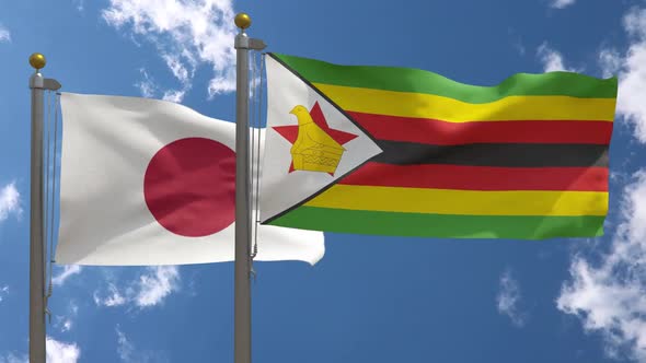 Japan Flag Vs Zimbabwe Flag On Flagpole