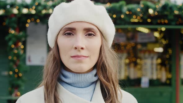 Portrait video of beautiful woman in winter clothes. Shot with RED helium camera in 8K. 