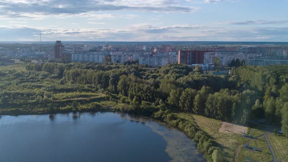 Aerial hyperlapse bird's eye view of river in middle of forest. Drone footage