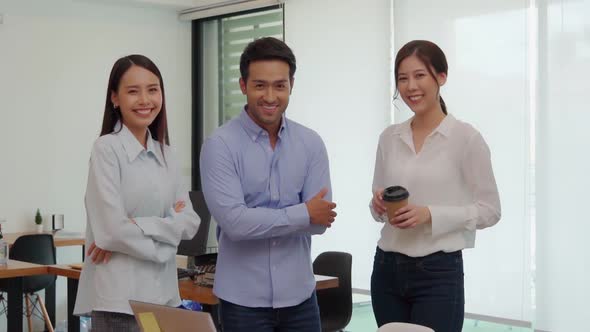 Slow motion Group of cheerful young Business Team Coffee Break holding coffee cups