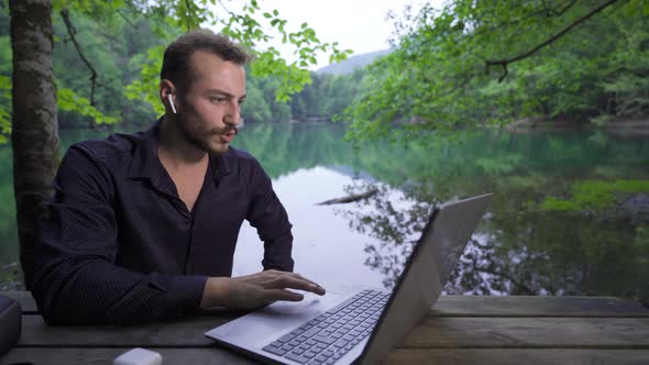 Working with a laptop in nature.