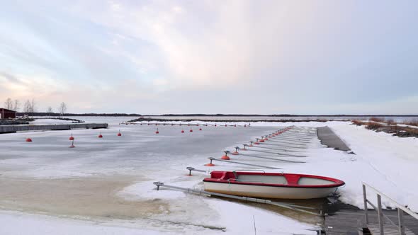 Lonely Boat In The Frozen Harbor