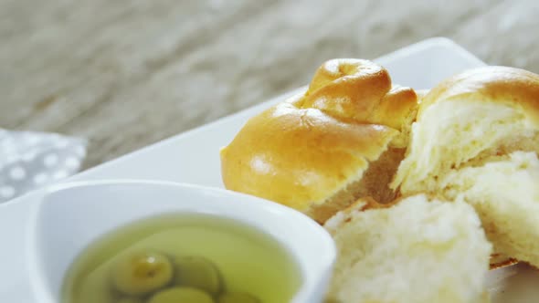 Pickled olives, herb and pieces of bread