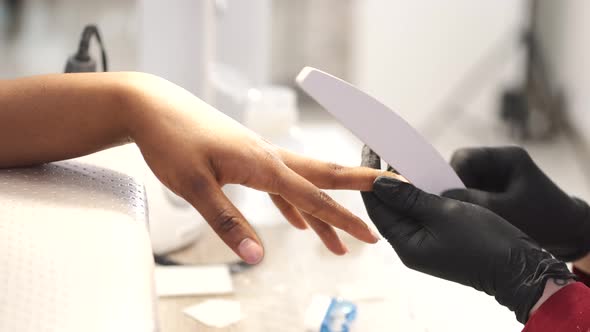 African Girl Doing Manicure in a Beauty Salon