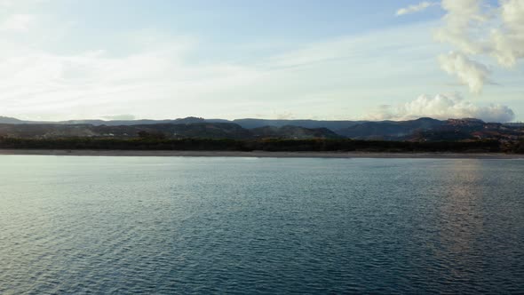 Sandy Coast near the Calm Ocean