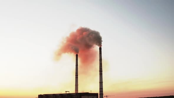 Aerial view of industrial zone with factory emission from factory pipes