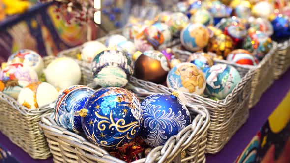 Boxes with Ornamental Christmas Baubles. Set of Wicker Boxes with Various Traditional Christmas