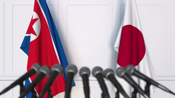 Flags of North Korea and Japan at International Press Conference