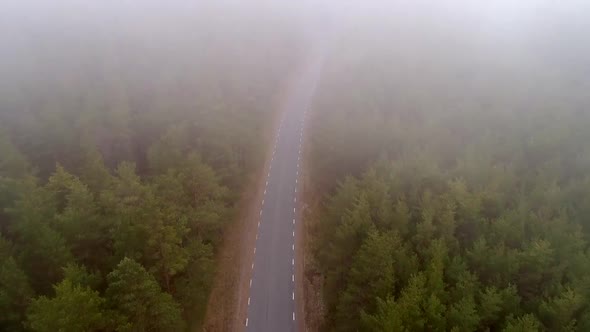 Aerial view of empty misty road in Tahkuna village, Estonia